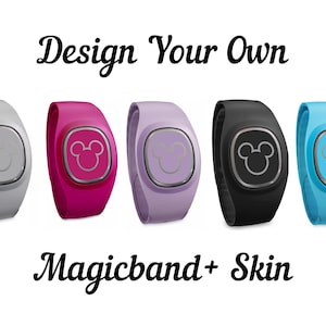 May include: Five different colored Magicbands with Mickey Mouse ears on the front. The colors are gray, pink, purple, black, and blue. The text "Design Your Own Magicband + Skin" is below the Magicbands.