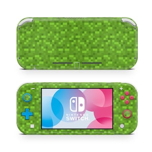 May include: Green pixelated Nintendo Switch Lite console with a pink and blue circle design on the screen. The console has a blue and green button on the left and a pink button on the right.