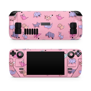 May include: A pink handheld gaming console with a black screen and origami animal designs. The console has a black joystick and buttons.