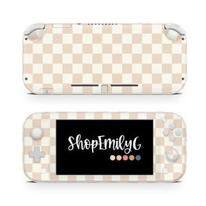May include: Two views of a beige and white checkered Nintendo Switch Lite. The top view shows the back of the device. The bottom view shows the front with the screen displaying "ShopEmilyG" in white script.