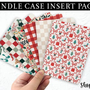 May include: A set of six printable Kindle case inserts featuring festive Christmas patterns. The patterns include red and white gingham, a checkered pattern, a floral pattern, and a pattern with red bows and green holly.