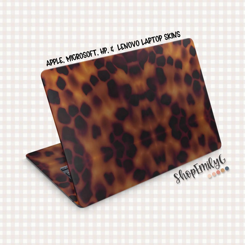 May include: Laptop skin with a tortoiseshell pattern in shades of brown and black. The skin is designed for Apple, Microsoft, HP, and Lenovo laptops. The text "APPLE, MICROSOFT, HP, & LENOVO LAPTOP SKINS" is printed at the top.