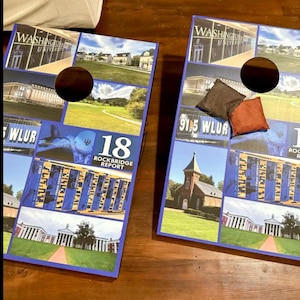 a pair of cornhole boards with various images of college campuses and buildings on them.