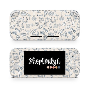 May include: A white Nintendo Switch Lite console with a custom skin featuring a blue and white pattern of various western-themed icons, including cowboy boots, horseshoes, cacti, and dice. The console's screen displays the text "ShopEmilyG" in black.