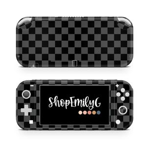 May include: A black and gray checkered skin for a handheld gaming console. The skin covers the front and back of the device. The screen displays the text "ShopEmilyG" in white script. The console has buttons and a directional pad.
