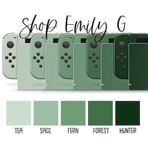 May include: A selection of green game controllers and console accessories, ranging in shades from light tea green to deep hunter green. The image includes the text "Shop Emily G" in a cursive font above the controllers.