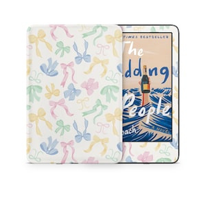May include: A white Kindle e-reader with a colorful bow pattern on the back. The screen displays the cover of the book "The Wedding People" by  Sarah Winman.