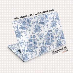 May include: A laptop skin featuring a blue floral pattern on a white background. The design includes detailed illustrations of flowers and leaves. Text at the top reads "APPLE, MICROSOFT, HP, & LENOVO LAPTOP SKINS". The ShopEmilyC logo is visible.