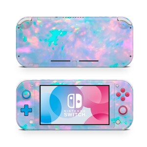 May include: A Nintendo Switch Lite console with a colorful, iridescent design. The handheld gaming device features a screen, buttons, and a back panel with a swirling pattern of blues, pinks, and greens. The Nintendo Switch logo is visible on the screen.