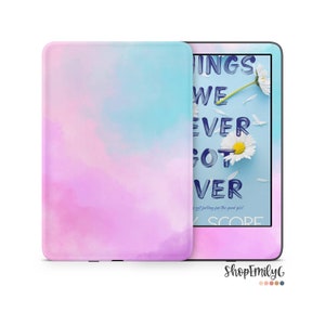 May include: A pastel-colored e-reader case and device. The case is a gradient of pink, purple, and blue. The e-reader screen displays the book cover "Things We Never Got Over" with daisies. The shop name "ShopEmilyG" is in the bottom right.
