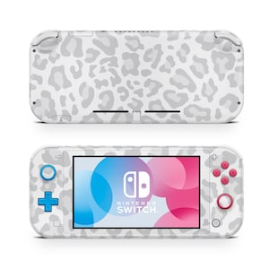 May include: White Nintendo Switch Lite console with a white and gray leopard print design. The console has blue and pink buttons and the Nintendo Switch logo is visible on the screen.