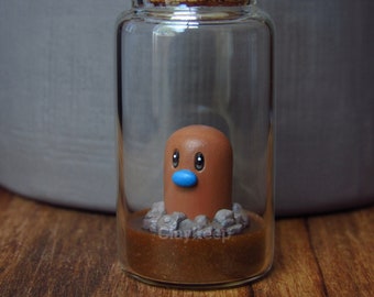 Pokémon Diglett en miniatura en una botella, figura de Pokémon en miniatura de arcilla polimérica, Pokémon en miniatura de arcilla