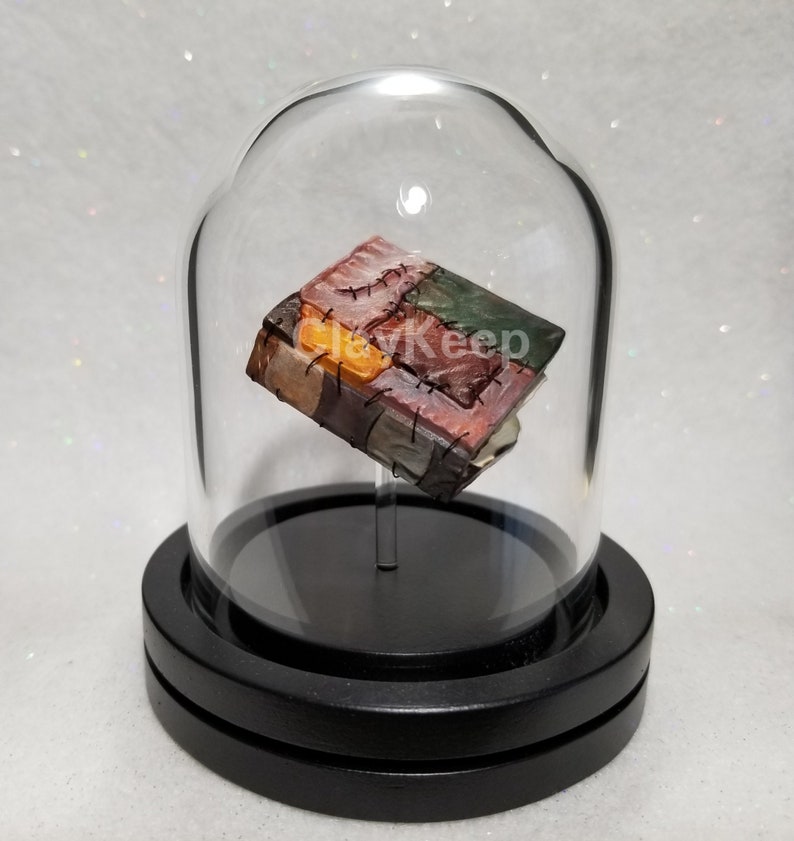 The Elder Scrolls Skyrim Miniature Oghma Infinium in a Glass Dome