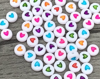 7mm Round White Bead with a Heart Design