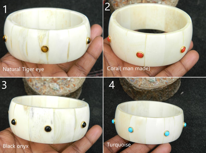 May include: Four bone bangles with different colored gemstones. The bangles are white with gold accents. The gemstones are tiger eye, coral, black onyx, and turquoise.