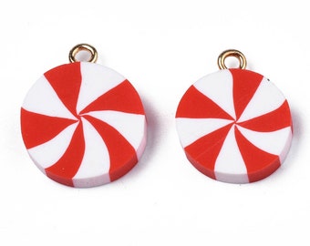 May include: Two red and white candy cane swirl charms with gold jump rings. The charms are round and have a 3D effect.
