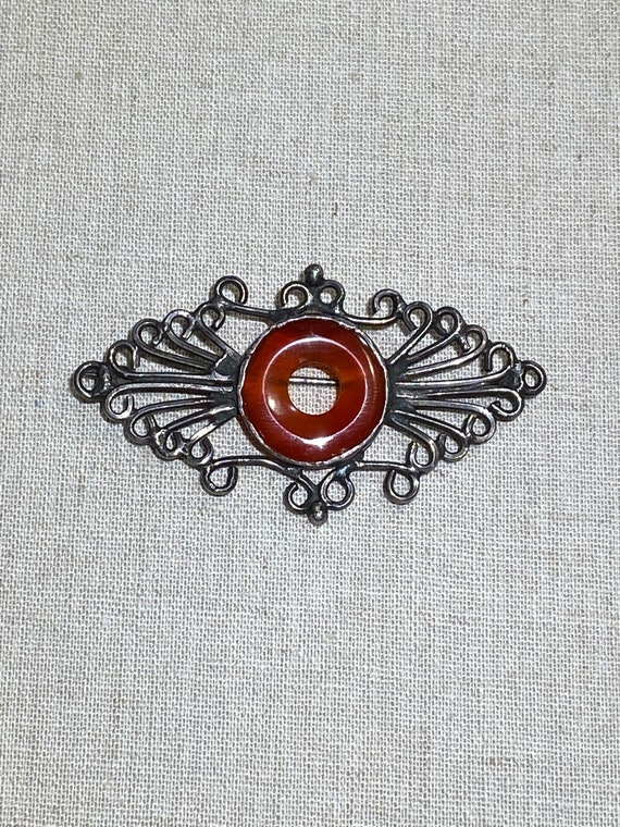 Handmade Wrapped Metal Brooch With Carnelian Cente