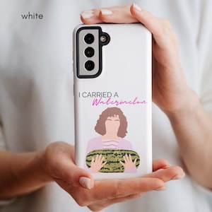 May include: White phone case with a cartoon illustration of a woman holding a watermelon. The text "I carried a watermelon" is printed on the case.