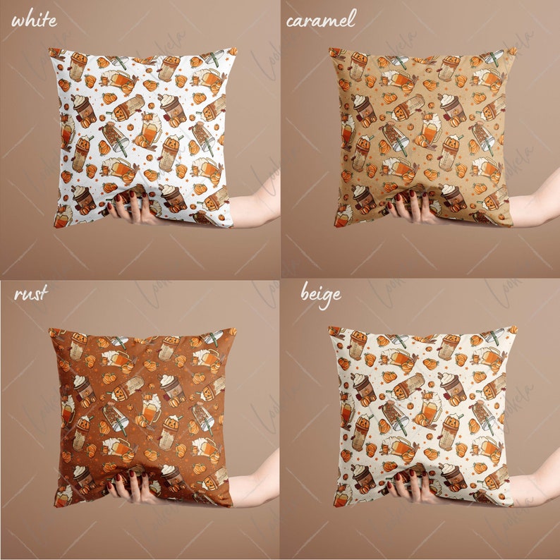 May include: Four square throw pillows with different colored backgrounds and a pattern of fall-themed coffee cups and pumpkins. The colors are white, caramel, rust, and beige.