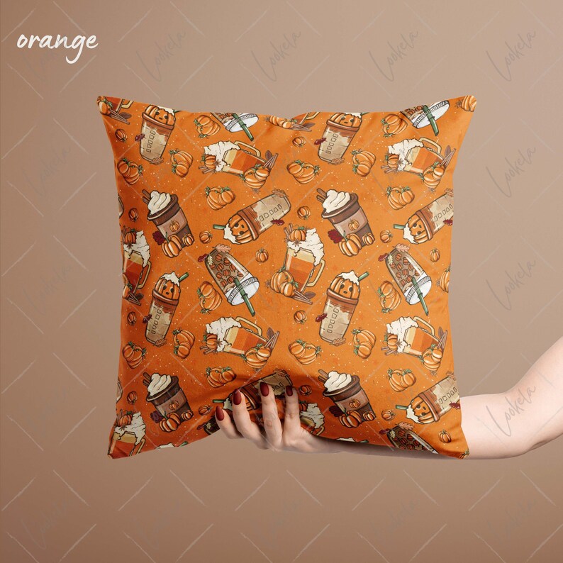 May include: Orange throw pillow with a pattern of pumpkin spice lattes, pumpkins, and cinnamon sticks.