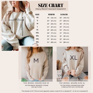 May include: Size chart for a heavy blend crewneck sweatshirt. The chart shows the width and length measurements in inches and centimeters for sizes XS to 5XL. The model is wearing a size M and a size XL sweatshirt.