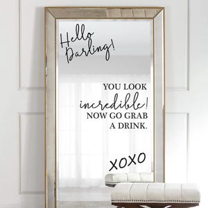 May include: A gold framed mirror with a motivational quote that reads "Hello Darling! You look incredible! Now go grab a drink. xoxo"