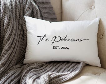 May include: White throw pillow with black text that reads "The Petersons EST. 2024".