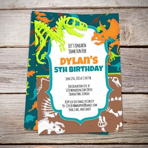 May include: A dinosaur-themed birthday party invitation with a green and yellow dinosaur skeleton on a blue and brown background. The text reads "Let's Unearth Some Fun For Dylan's 5th Birthday" with the date, time, and location of the party.