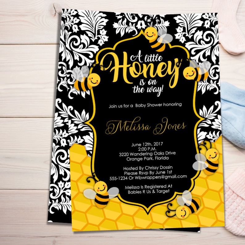 May include: A black and white damask patterned baby shower invitation with a yellow honeycomb background. The invitation reads "A little Honey is on the way!" and includes the name "Melissa Jones".