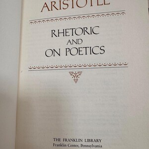 May include: An open book page displaying the title "ARISTOTLE" in brown, above "RHETORIC AND ON POETICS". The text is centrally aligned, with decorative lines and a symbol. The Franklin Library imprint is at the bottom of the page.