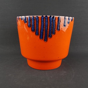 May include: A set of three ceramic mugs with a speckled, matte finish. The mugs are in shades of cream, light gray, and dark gray. Each mug has a simple, minimalist design, perfect for coffee or tea.