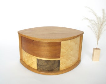 Simple and elegant wooden urn made of butternut and decorated with inlay
