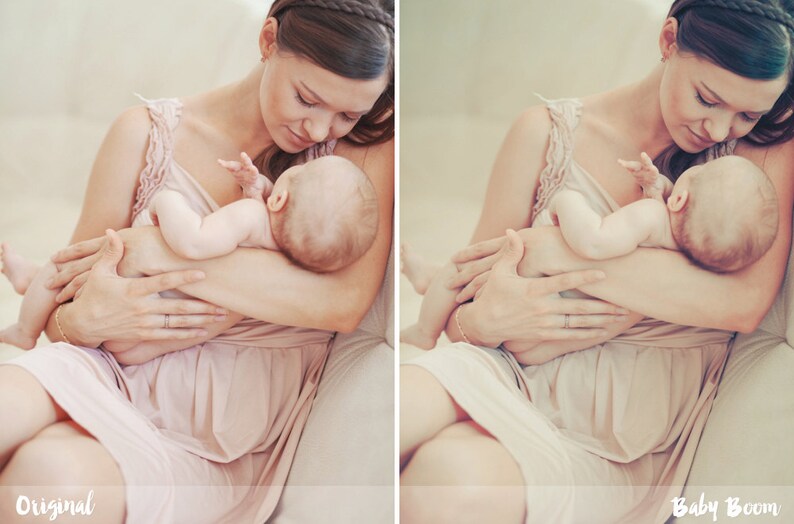 May include: A woman in a pink dress holds a baby in her arms. The baby is wearing a white onesie and has a soft, sleepy expression. The woman is looking down at the baby with a loving smile.