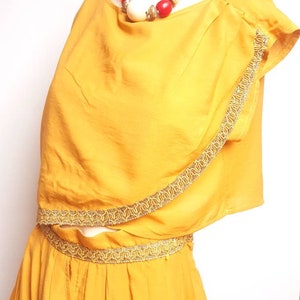 Vintage top and skirt made in 80s  oriental look unique designe vintage set higj waist skirt whit asimetric top decorated whit gold ribbon