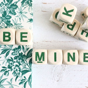 Vintage Letter Cubes spell out the words BE MINE, and extra cubes.