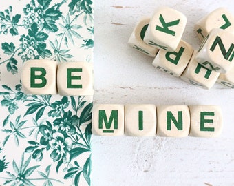 Vintage Letter Cubes spell out the words BE MINE, and extra cubes.