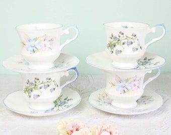 Set of 4 vintage English pastel tea cups and saucers.