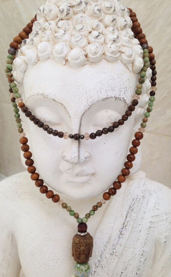 Items similar to Buddha Necklace on Etsy