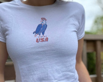 Cowboy Eagle USA T-Shirt | Patriotic 4th of July USA Baby Tee | Red, White, and Blue Bald Eagle USA America Women's Cropped Shirt