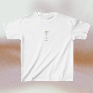 image of a white t-shirt with a watercolor martini in the center of the chest, along with the word "DIRTY"