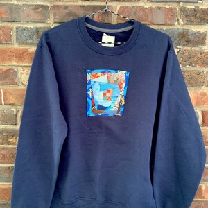 Super soft reclaimed navy sweatshirt with quilted patch