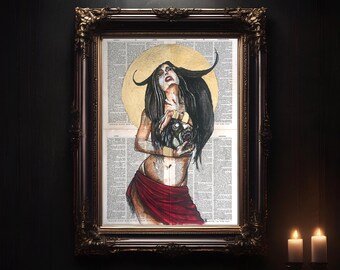 May include: A framed artwork featuring a woman with long black hair and a golden halo, holding a creature's head. The artwork is set against a backdrop of dictionary pages and framed in a dark, ornate frame. The woman is wearing a red skirt.