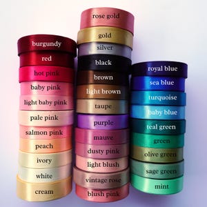 Color chart showing 33 ribbon options for wedding satin wands, including ivory, pale pink, white, dusty pink and mauve.