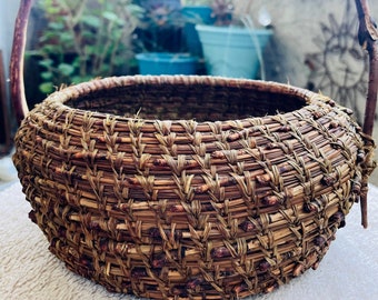 Vintage pine needle basket with branch handle