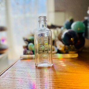 Vintage clear glass bottle with embossed Sloan&#39;s Liniment
