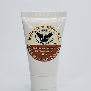 May include: A white tube of Healing & Soothing Salve for pets, labelled "The Pet Gliders" with a brown and white logo of a sugar glider. The label also says "1 oz", "Safe if consumed", and "All Organic".
