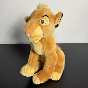 May include: A set of three ceramic mugs with a speckled, matte finish. The mugs are in shades of cream, light gray, and dark gray. Each mug has a simple, minimalist design, perfect for coffee or tea.