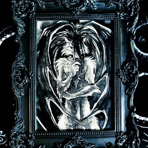 May include: A black and white drawing of a wolf-like creature with wings, framed in a black ornate frame.