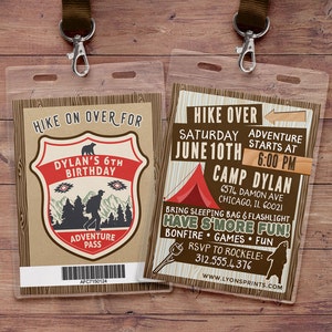 May include: A brown and tan camping-themed birthday party invitation with a red tent, a bear, and the text "HIKE OVER SATURDAY JUNE 10TH ADVENTURE STARTS AT 6:00 PM CAMP DYLAN 6574 DAMON AVE CHICAGO, IL 60021 BRING SLEEPING BAG & FLASHLIGHT HAVE S'MORE FUN! BONFIRE GAMES FUN RSVP TO ROCKELE: 312.555.4376 WWW.LYONSPRINTS.COM"