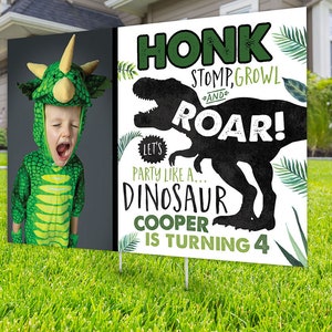 May include: A white sign with green and black dinosaur graphics. The sign says "Honk, Stomp, Growl and Roar! Let's Party Like a... Dinosaur. Cooper is turning 4". A child dressed as a dinosaur is pictured in the background.
